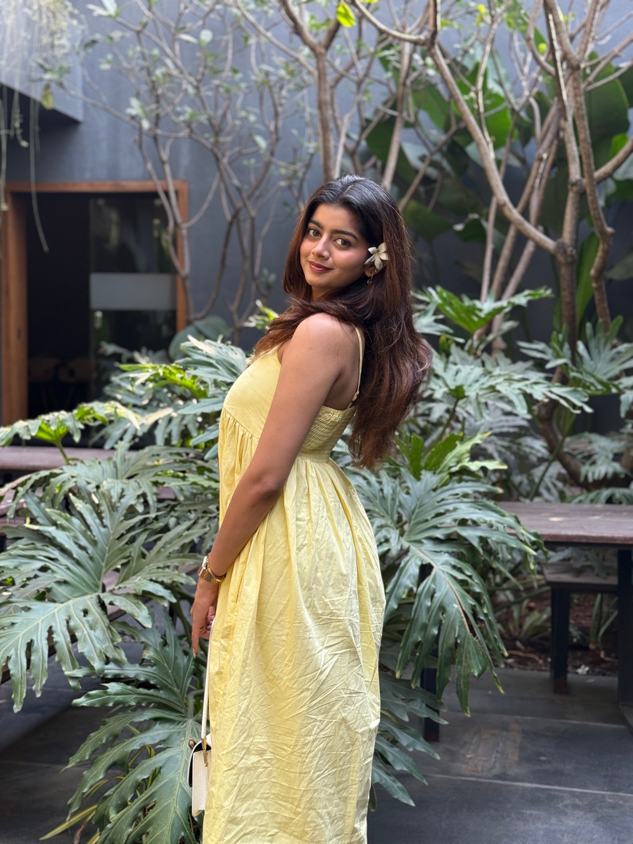 Garden courtyard shoot in a yellow sundress